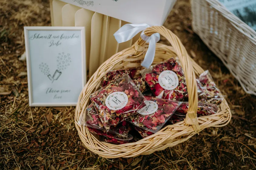 Basket of flower confetti bags with sign for the ceremony