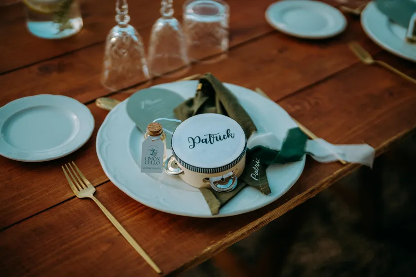 Place setting with name card and limoncello wedding favor
